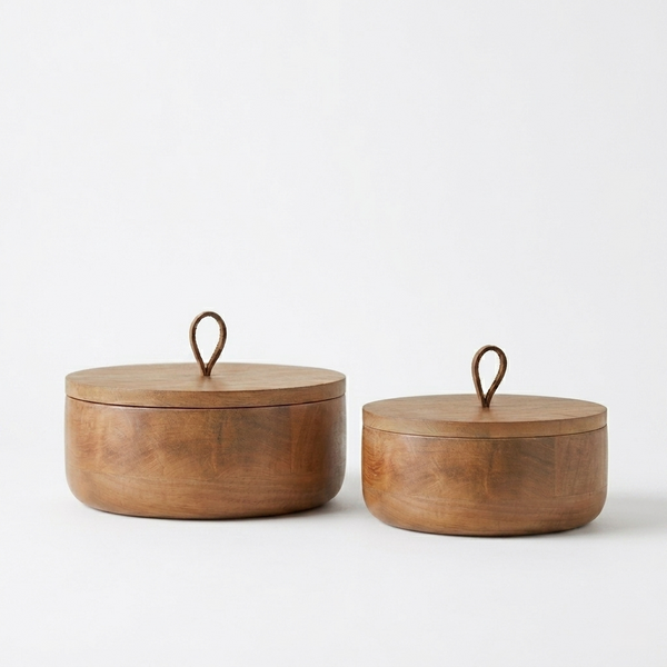 Two wooden containers with lids on a white background
