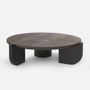Round wooden coffee table with a dark finish on a white background