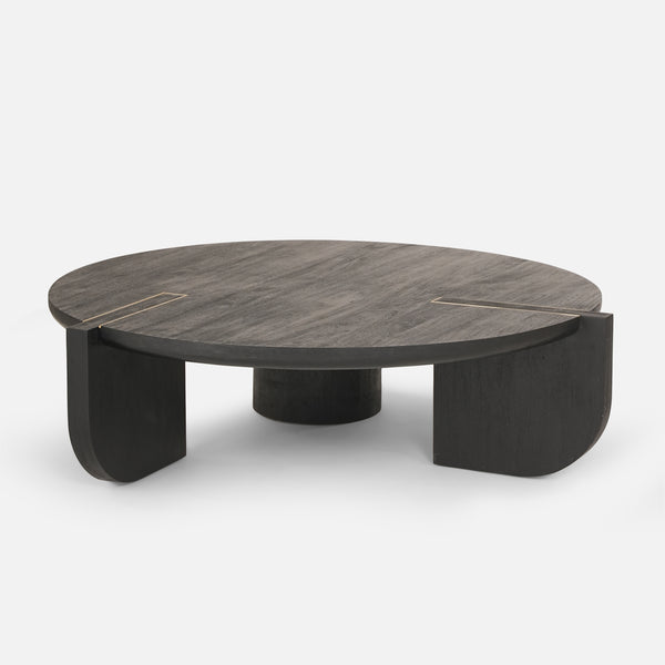 Round wooden coffee table with a dark finish on a white background