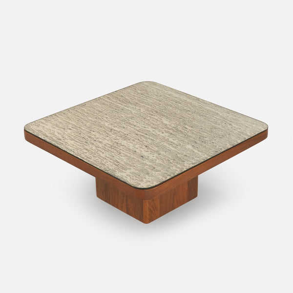 Square coffee table with wooden base and beige top on a white background