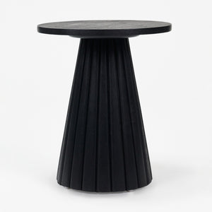 Black side table with a round top on a white background