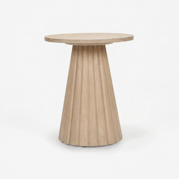Wooden side table with a round top and fluted cylindrical base on a white background