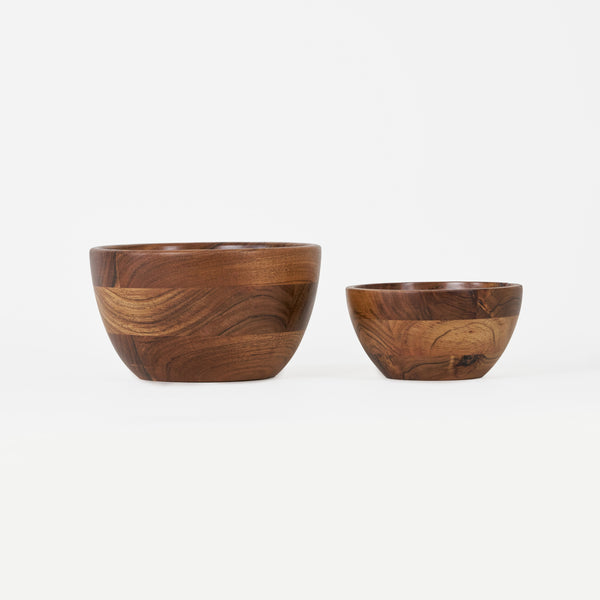 Two wooden bowls on a white background