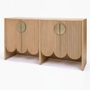 Wooden console table with scalloped edge design on a white background