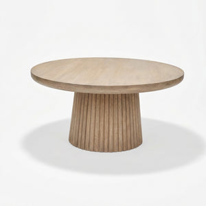 Wooden round table with a ribbed cylindrical base on a white background