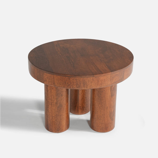 Wooden stool with a round top and four legs on a white background
