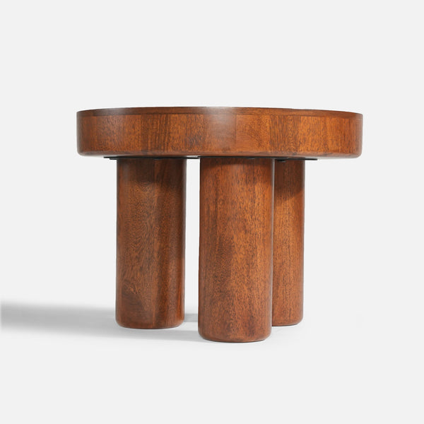 Wooden side table with cylindrical legs on a white background