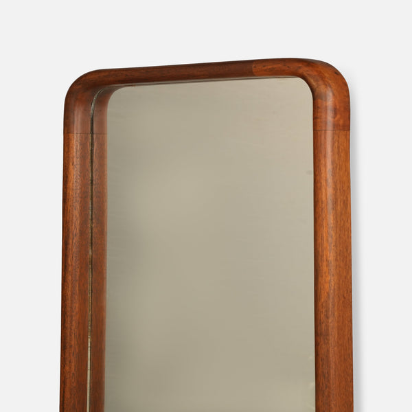 Wooden-framed mirror on a white background