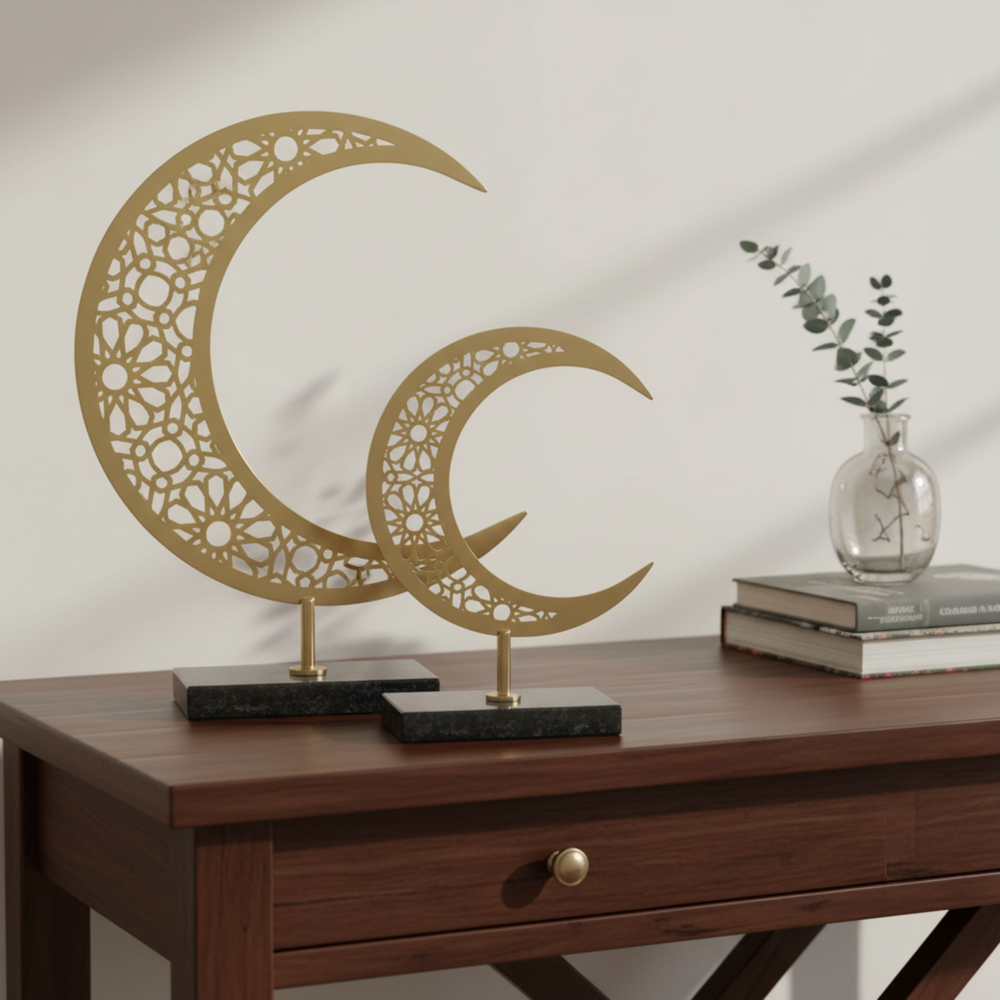 Decorative metal crescent moon sculptures on a table in a living room setting.
