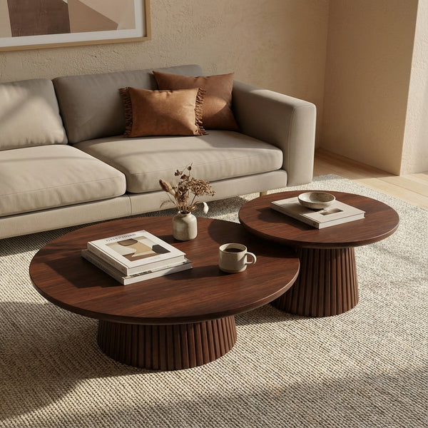 Living room with beige sofa, wooden coffee tables, and decorative items.