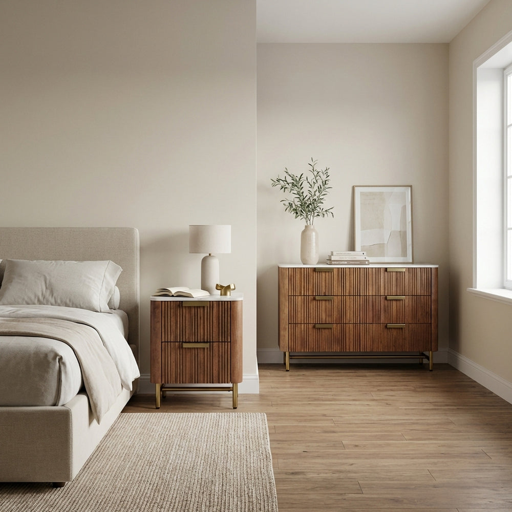 Modern bedroom with wooden dresser, nightstand, and bed.